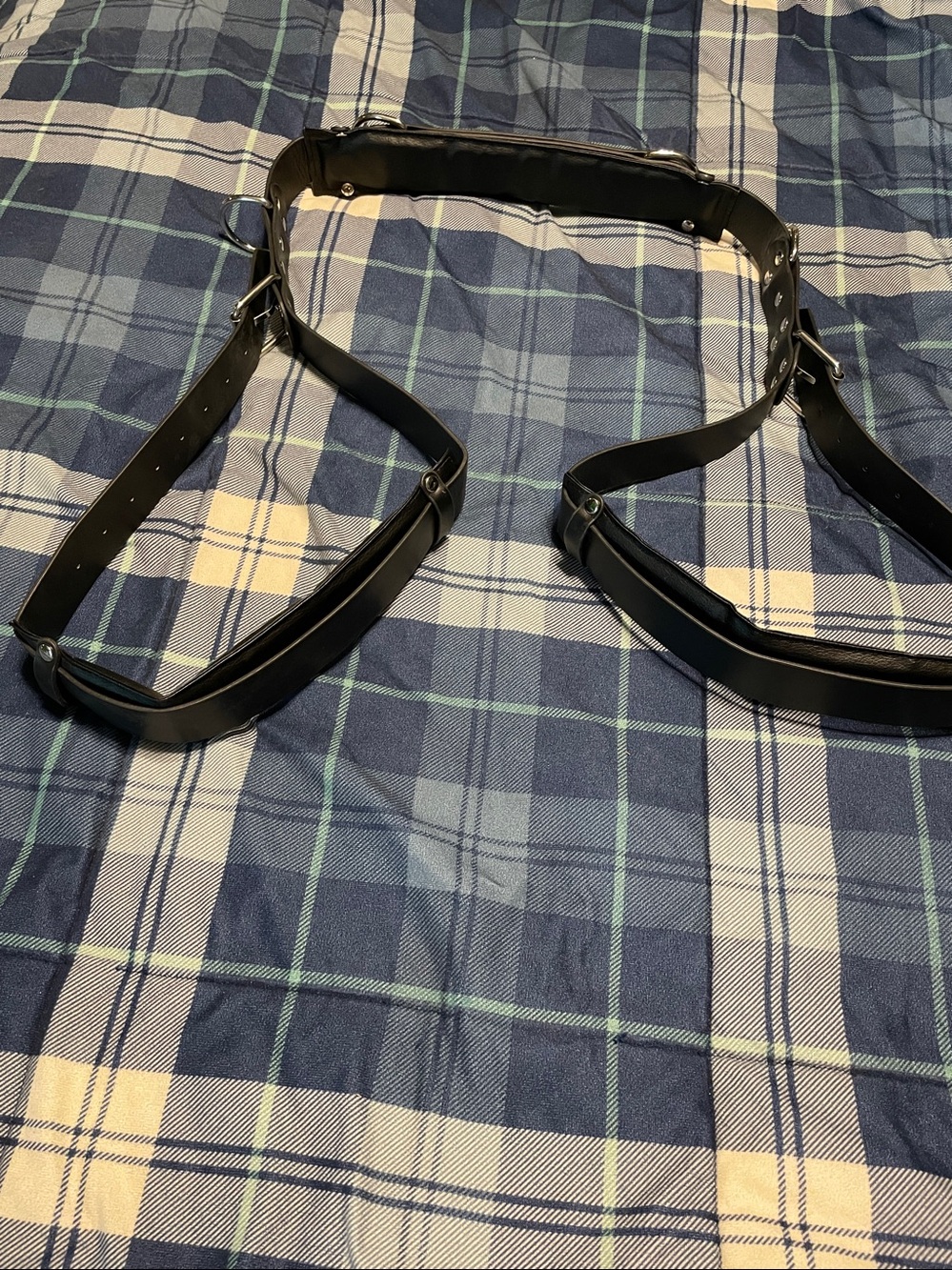 worn over neck and legs placed into adjustable openings